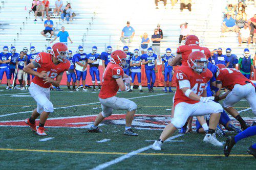JOE MARINACCIO, a senior captain (#8), returns at running back for the Warriors this fall. However senior QB Kobey Nadeau (#12) has been lost for the season as the WMHS football team seeks to rebound this season. (Donna Larsson File Photo)