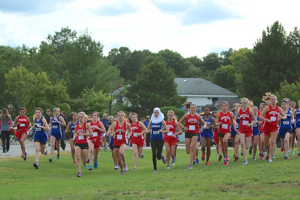 THE WMHS girls’ cross country team ran against Stoneham yesterday at the Spartans’ new home course at the Colonial Park Elementary School. The Warriors won, 16-47. (Donna Larsson Photo)