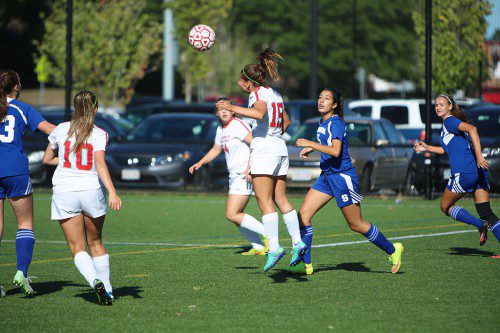 CHRISTINA LEBLANC, a sophomore forward (#15), assisted on Wakefield’s only goal of the game as the Warriors tied Stoneham, 1-1, yesterday at Walton Field. On the left is senior midfielder Brianna Smith (#10). (Donna Larsson Photo)