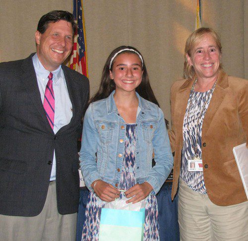 SUMMER READING CHALLENGE WINNER Jade Roycroft, in Grade 7 at the Galvin Middle School, accepts her prize from School Committee Chairman Greg Liakos and School Superintendent Dr. Kim Smith. (Mark Sardella Photo)
