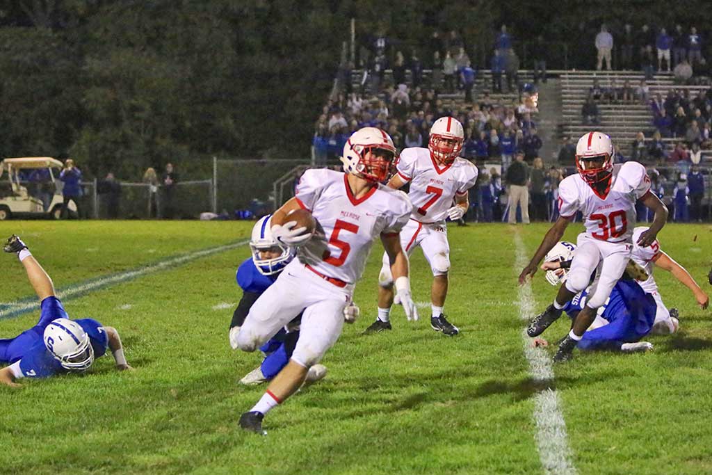 MIKE PEDRINI'S two fourth quarter touchdowns and a well timed 2-point conversion helped spearhead a Melrose comeback over Stoneham, 15-14, last Friday night on the road. Melrose hosts Woburn tonight at 7:00 p.m. (Donna Larsson photo) 