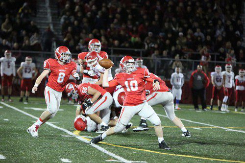 SOPHOMORE QB Mike Lucey (#10) threw two touchdown passes as he completed nine out of 16 passes for 170 yards in Wakefield’s 22-12 victory over Burlington on Friday night at Landrigan Field. Moving into block are Joe Marinaccio (#8) and Dan Cataldo (#55). (Donna Larsson Photo)