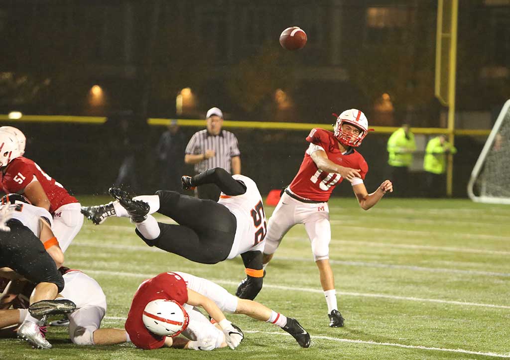 MELROSE QB Jack May's threw for a second half touchdown that helped Melrose run away with a win over Woburn, 33-13 last Friday. (Donna Larsson photo)