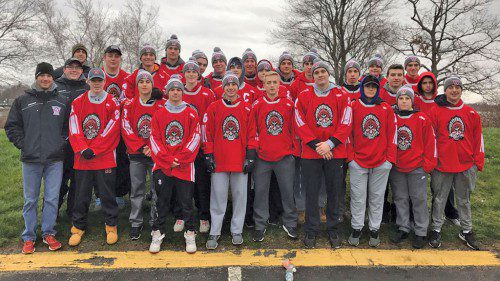 THE WMHS boys’ hockey team volunteered at the seventh annual AMPT “Earn Your Turkey” 5K race last Thursday morning at Lake Quannapowitt. The Warriors helped race officials break down the equipment at the event and handed out T-Shirts to the runners.