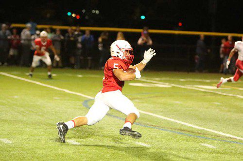 ALL PEDRINI. The Melrose Red Raider football team relied on Mike Pedrini's 5 touchdowns and 300 total yards to lift them 35-21 over Wayland on Nov 4 and improve to 6-3. (Donna Larsson photo) 