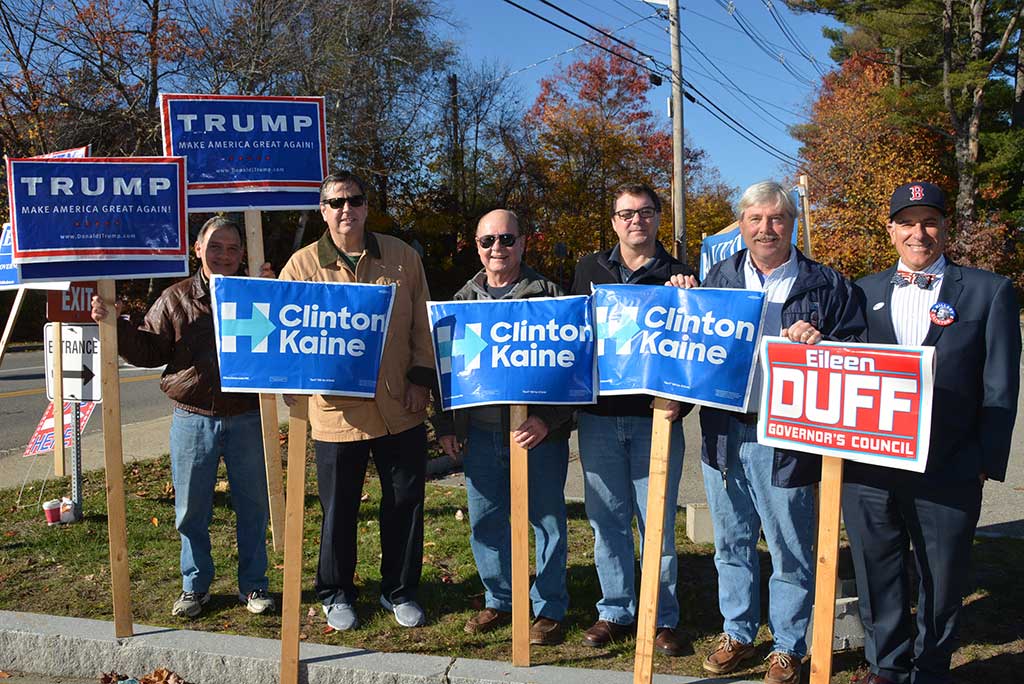 HILLARY CLINTON AND DONALD TRUMP were well represented by political sign holders outside the town's polling places at St. Theresa Church. From left: Jeff Yull, Mike Connors, Brad Prenney, Bill Griffin, Steve O'Leary, Geoff Simons. (Bob Turosz Photo)