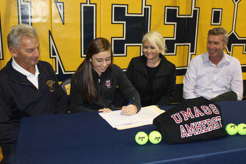 GIRLS’ TENNIS star Sarah Mezini (second from left) signed her letter of intent with UMass-Amherst while being flanked by, from left, girls’ tennis head coach Craig Stone and parents Klediena and Erlir Mezini. (Dan Tomasello Photo) 