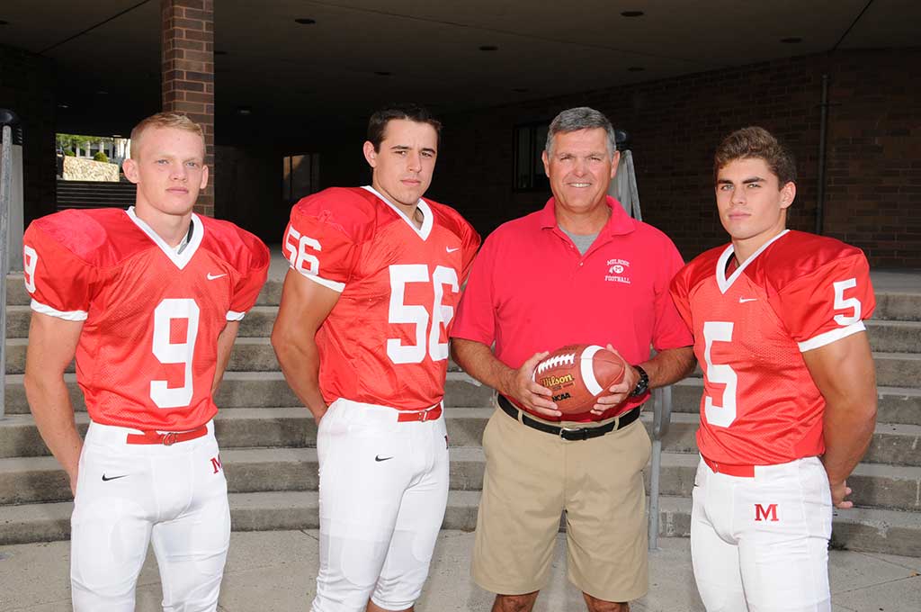 RED RAIDER tri-captains helped lead Melrose to another winning season in 2016. They include from left (with coach Tim Morris) Steven Abbott, Collin Casey and Mike Pedrini. (Terry Bleiler photo)