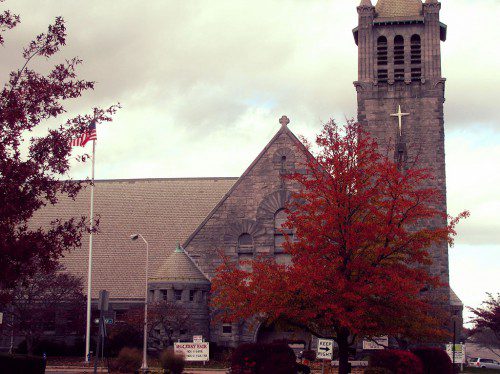 A TREE'S AUTUMN LEAVES stand out against the Congregational Church. (Mark Sardella Photo)
