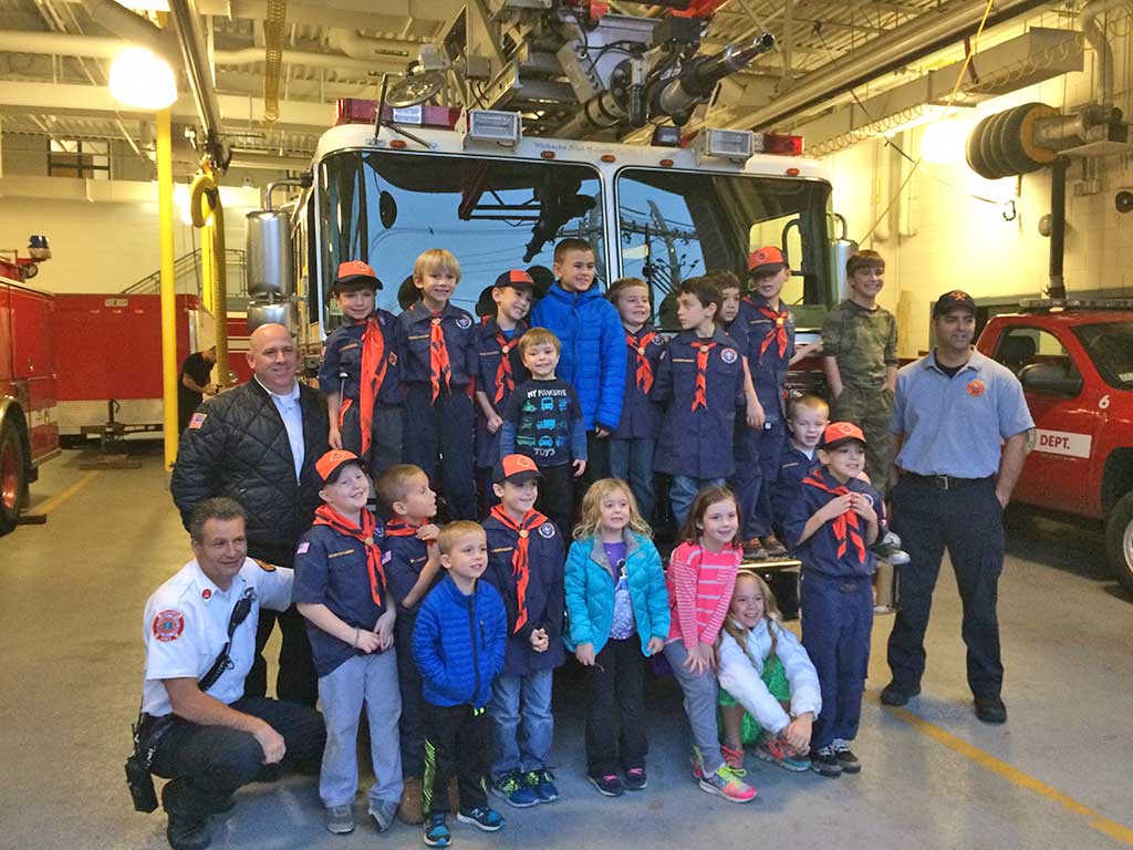THE CUB SCOUTS' Den 3 Tigers and their families visiting fire headquarters at the Public Safety Building recently. They want to thank Fire Captain Chris Smith and all other firefighters for a fun and educational tour. 