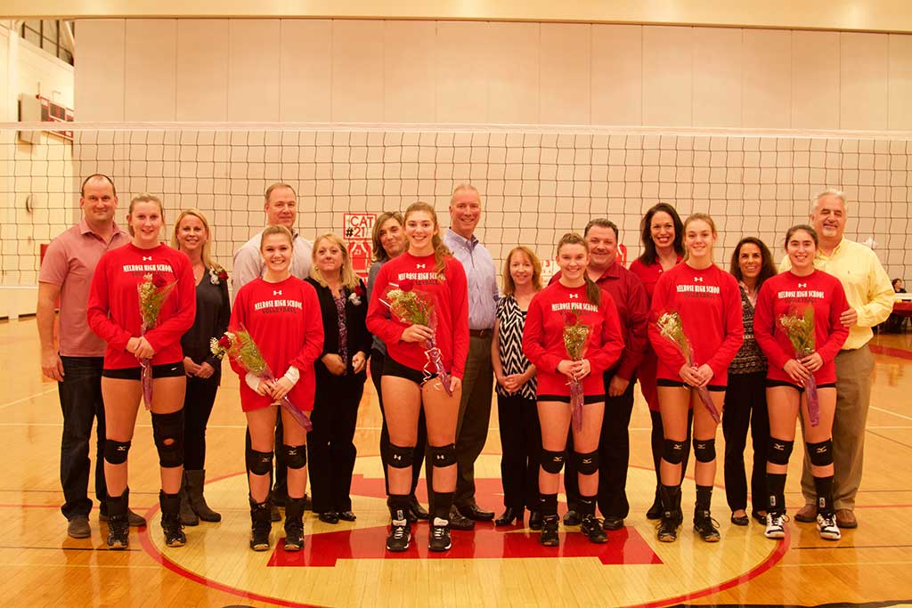 MELROSE VOLLEYBALL celebrated clinching the Middlesex League and honored their seniors at the team's last home game of the season on Monday. Pictured from left with their families are seniors: capt. Cat Torpey, capt. Kaitlyn McInnes, capt. Victoria Crovo, Kate Donovan, Julia Symonds and Emily DiPietro. (Donna Larsson photo)