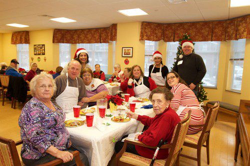 THE GOAL WAS to make people happy last Sunday, and a diverse group of volunteers did just that at the Wakefield Housing Authority’s Harts Hill residential facility. (Donna Larsson Photo)