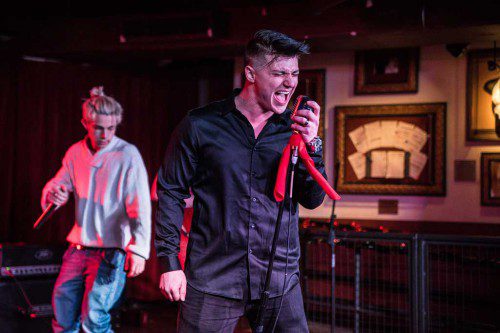 LYNNFIELD’S Joe Dias performs at Boston’s Hard Rock Café during the fundraising rock concert he organized to benefit pediatric cancer research to honor his late sister Gianna. (Ben Esakof/Roman’s Rap-Up Media Group)