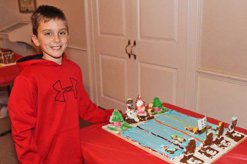 FOURTH GRADER Andrew Lombardi won the Totally Cool category for his Olympic swimming themed gingerbread house during the 12th annual Gingerbread House Contest recently. (Dan Tomasello Photo)