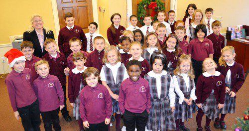 ST. JOSEPH SCHOOL students were a pleasant surprise for customers of the Lakeside Office of The Savings Bank on Saturday morning when they performed as part of the 2016 Holiday Music Series. Bank customers and friends are encouraged to stop by the Bank’s Main Office this Saturday, Dec. 17, to enjoy Wakefield Flutes from 9:30 to 11:30 a.m.