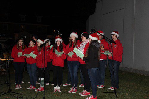 DURING FRIDAY NIGHT’S downtown tree lighting event sponsored by the Wakefield Center Neighborhood Association, Wakefield Memorial High’s Voices of Steel provided some of the entertainment. (Keith Curtis Photo)