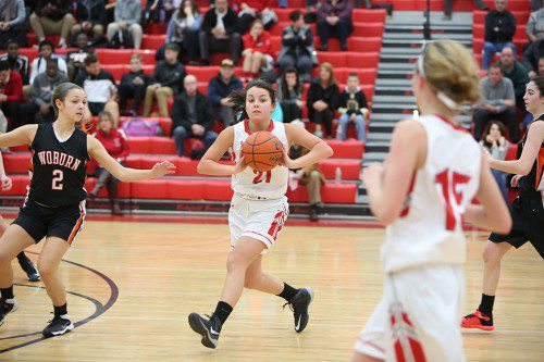 ALLY COGGSWELL, a junior (#21), gets ready to pass the ball to one of her teammates, Grace Hurley (#15). Coggswell is one of eight returning varsity players from last year’s girls’ basketball team. (Donna Larsson File Photo)
