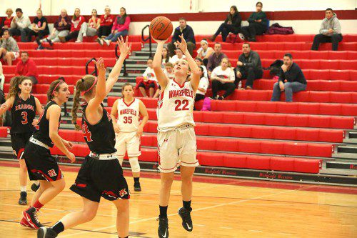 HAILEY LOVELL, a junior (#22), scored 10 points and was one of three Warrior players to do so in their 48-26 rout over Arlington last Thursday night. (Donna Larsson File Photo)