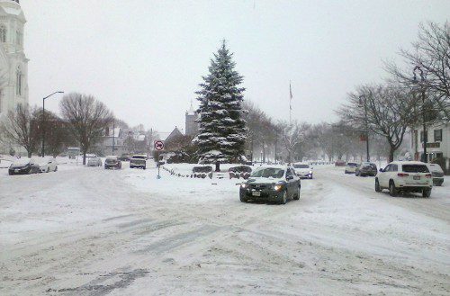 THE FIRST significant snow storm of the winter made driving hazardous but it also created a pretty winter scene with the town Christmas tree as the centerpiece. (Mark Sardella Photo)