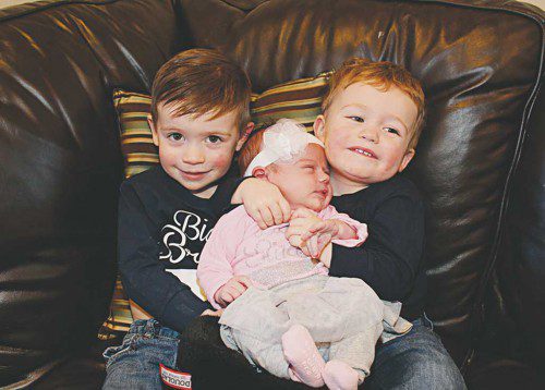 BIG BROTHERS JJ (left) and James love to hug and spoil their new baby sister, Julianna. (Maureen Doherty Photo)