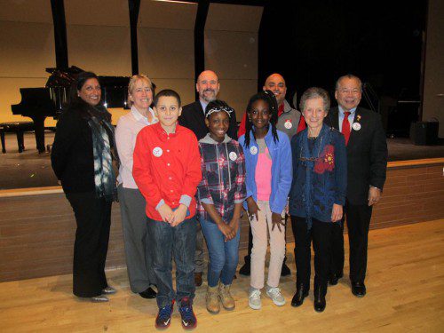 AMONG THOSE attending yesterday’s Unity Celebration were, front row, from left: Galvin Middle School grade 5 students Ismael Morales III, Marian Diallo and Hawa Sheriff and Wakefield Resident Award recipient Merry Eldridge. Back row, from left: Keynote speaker Mehreen N. Butt, Superintendent of Schools Dr. Kim Smith, State Rep. Paul Brodeur (D-Melrose) and State Rep. Donald Wong (R-Saugus/Wakefield). Not present for the photo were award winners Maeve Conway and Amanda Bruce. (Gail Lowe Photo)