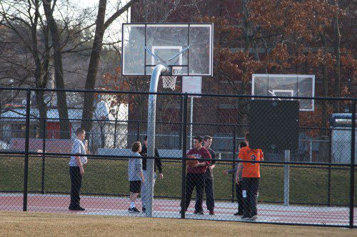 ONE DAY LAST WEEK temperatures got into the high 50s and overall January has been warmer than usual. It was comfortable enough to go outside at the Galvin for a little basketball. (Donna Larsson Photo)