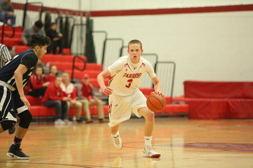 JUNIOR GUARD Andrew Miller had a game high 16 points in Wakefield’s 47-45 non-league victory over Malden last night at the Charbonneau Field House. (Donna Larsson Photo)