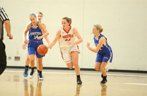 HAILEY LOVELL, a junior (#22), scored eight points for the Warriors in their big road win against Watertown on Friday night. Wakefield is now in first place in the Middlesex League Freedom division all by itself. (Donna Larsson File Photo)