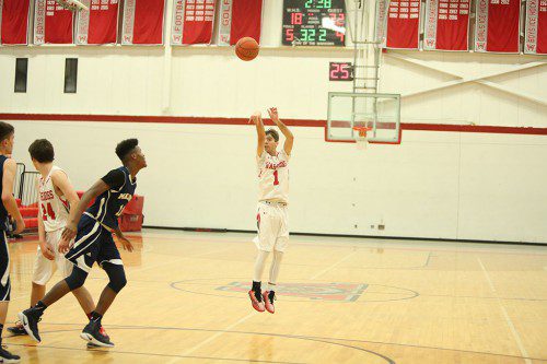 JOHN EVANGELISTA, a senior guard, netted a game high 26 points including six three-pointers in Wakefield’s 83-64 triumph over Belmont on Friday night at the Charbonneau Field House. (Donna Larsson File Photo)