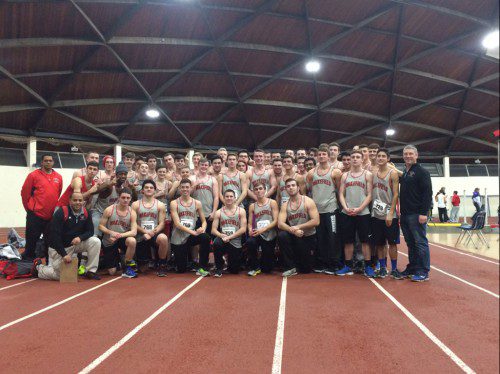 THE WMHS boys’ indoor track team celebrates after capturing its second Middlesex League Freedom division title in three years last night at the Lexington Field House. Wakefield capped off the dual meet season with a perfect 5-0-0 record.