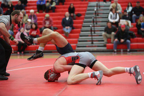 JACK SPICER, a senior captain, earned his 100th career victory as he recorded three wins at the 138 weight class in a quad meet on Saturday at the Charbonneau Field House. The milestone came against Woburn. (Donna Larsson File Photo)