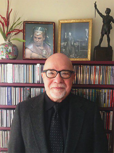 HOWARD HART, founder of Opera Club of Wakefield, is shown with his CD collection and photos of Roberto Alagna as Radames in “Aida” and Maria Callas in concert. The bronze statue at right is Siegmund from Wagner’s “Ring.” (Courtesy Photo)