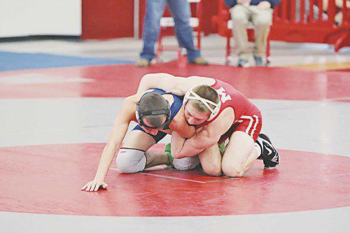 LEAGUE CHAMPS. Melrose High clinched the Middlesex League with a victory over Watertown last week, and crowned seven individual league champs on Saturday at the ML championship, including Steven Macintosh (pictured). (Steve Karampalas photo) 