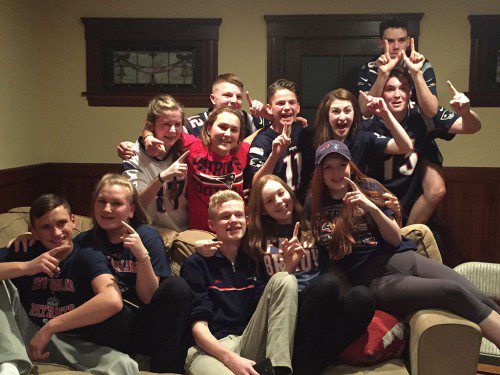 THESE STUDENTS at Wakefield Memorial High showed off their Patriots team spirit last night while watching Super Bowl 51, won dramatically by New England in overtime against the Atlanta Falcons. A victory parade is planned in Boston tomorrow morning to celebrate the Patriots' fifth championship title. 