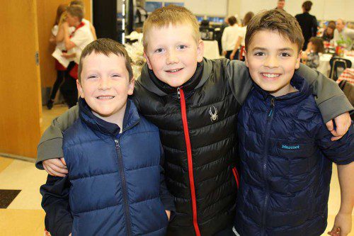 SUMMER STREET SCHOOL students, from left, Justin George, Drew George and Ben Dahlstedt hang out during the third annual Pasta Palooza family dinner March 22. The Summer Street School PTO sponsored the event. (Dan Tomasello Photo) 