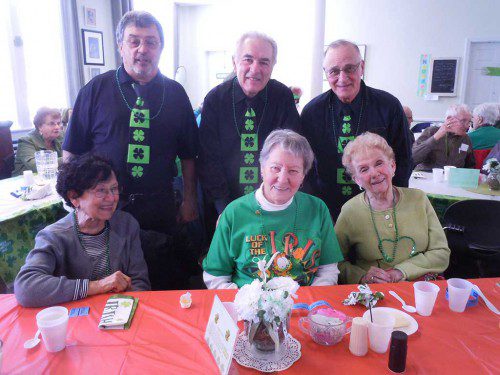 All eyes were smiling at the Edith O’Leary Senior Center’s Saint Patrick’s Day party. Great entertainment was provided by the three men standing, “The Carrtunes, Donn Carr, John Camilia and Tom Reppucci, and enjoying the day were Vicky Boniface, Ann Donahue and Ann Connors. (Courtesy Photo)