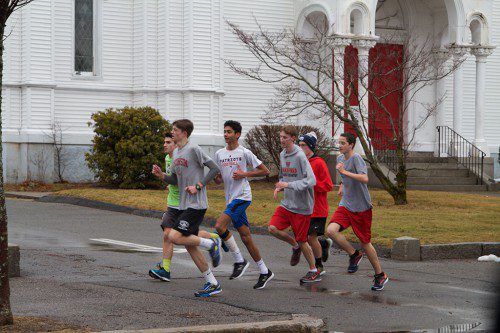 THOSE WHO RUN for the Wakefield Memorial High track team have been seen all around town getting ready for their 2017 spring season. Here are some athletes traversing the downtown. (Donna Larsson Photo)