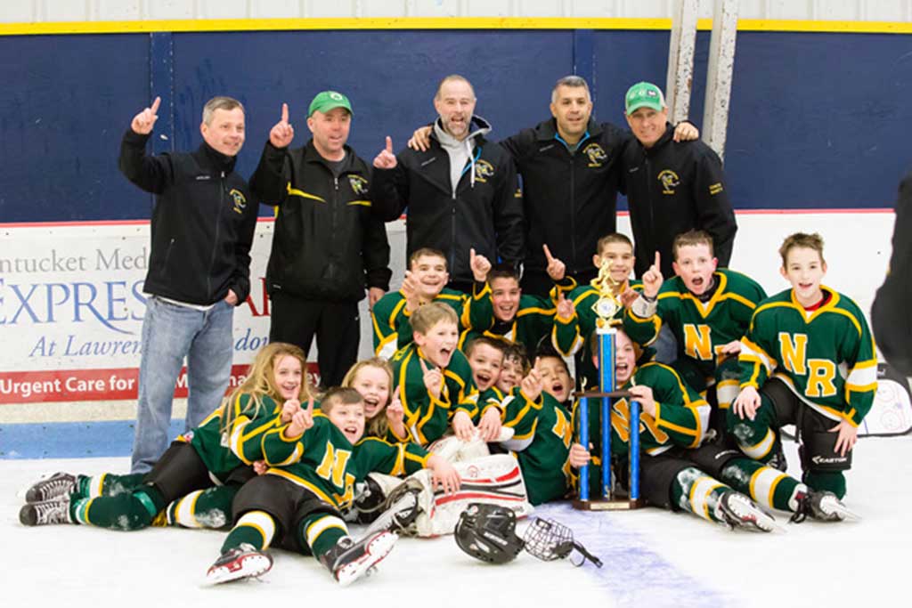 The storybook season for the players, families and coaches of the 2016-2017 North Reading Squirt Ice Hockey Team concluded in thrilling fashion earlier this month.  Proudly wearing the green and yellow with a bold “NR” on their sweaters, our heroes etched an emphatic exclamation point at the end of their outstanding athletic campaign with a 4-3 overtime victory in the Valley Hockey League Championship Final. (Courtesy Photo)