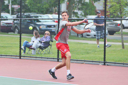 SENIOR CAPTAIN Jack Wells has been outstanding in first singles for the Melrose Red Raider tennis team, who recently took wins over Burlington and Arlington. (Donna Larsson photo)