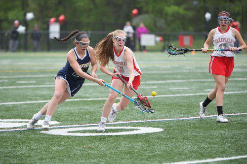 SENIORS Kelsey Czarnota (#3) and Brianna Smith (#11) are two out of five returning players for the Warrior girls’ lacrosse team this spring. (Donna Larsson File Photo)