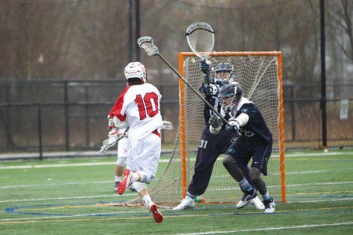 JACK WELLS had four goals for the Melrose Red Raider lacrosse team who took a 12-2 opening day win over Peabody at Fred Green Field in Melrose on Tuesday. (Donna Larsson photo) 