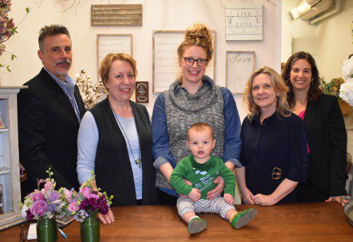BETH HYLAN OF SweetBay (second from left) and her daughter Liz Ferreira (center) will create the floral arrangements that will be featured at the 10th annual Blossoms at the Beebe to benefit the Lucius Beebe Memorial Library and the Wakefield Lynnfield Chamber of Commerce. The adult-only event will be held this Saturday evening, April 29th from 7 p.m. to 11 p.m. at the Library, 345 Main Street. Tickets can be purchased in person at the Beebe Library Reference Desk or online at www.blossomatthebeebe.com for $35 per person. A limited number of tickets may be available at the door on April 29th for $40 per person. Thanking Beth and Liz for their hard work are (from left) Chris Barrett, Wakefield Lynnfield Chamber of Commerce 1st Vice President and chair of the Blossoms at the Beebe sponsorship committee; Susan Wetmore, Chair of the Blossoms at the Beebe; and Marianne Cohen, Executive Director of the Wakefield Lynnfield Chamber of Commerce. Joining in the festivities is Liz’s son James Ferreira. 