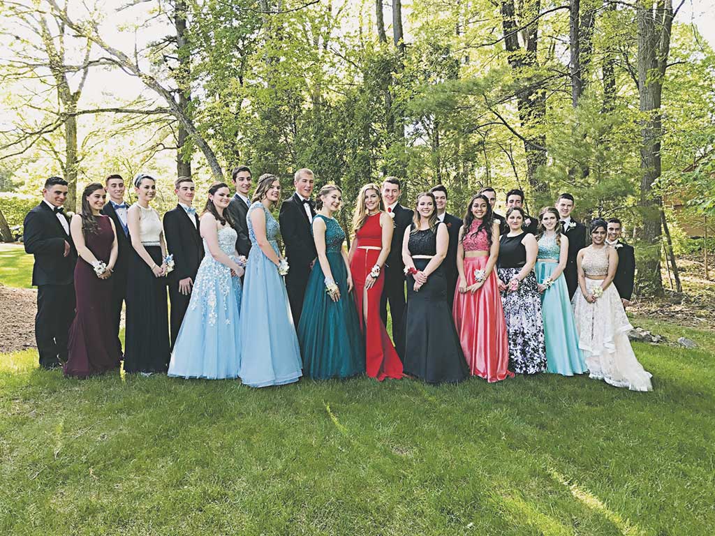 ELEVEN COUPLES gathered at the home of Joe and Sandra Motzkin home on North Hill Drive for a photo session prior to the traditional Junior Prom Grand March at LHS on Friday afternoon.  