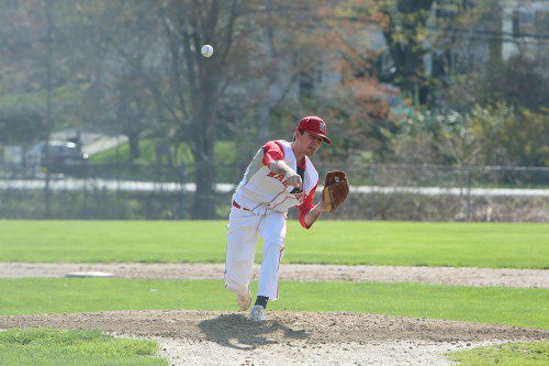JOHN EVANGELISTA, a senior, had a sensational outing as he threw 64 pitches and faced just two batters over the minimum in a complete game effort on the mound. The Warriors blanked Burlington by a 5-0 score at Walsh Field. (Donna Larsson File Photo)