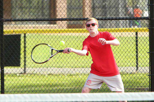 JAMES HANRON, a senior captain, concluded his high school tennis career with a 6-4, 7-5 triumph at first singles in Wakefield’s 5-0 shutout over Stoneham in the season finale. (Donna Larsson File Photo)