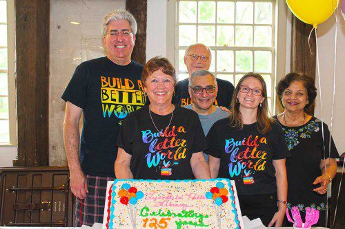 LIBRARY OFFICIALS proudly display the birthday cake at the Lynnfield Library’s 125th birthday celebration at the Meeting House July 22. Front row, from left, Library Trustees Vice Chairwoman Faith Honer-Coakley, Library Trustee Richard Mazzola, Library Director Holly Mercer and Library Trustee Janine Rodrigues-Saldanha. Back row, from left, Library Trustees Chairman Bob Calamari and Library Trustee Russell Boekenkroeger. (Dan Tomasello Photo)