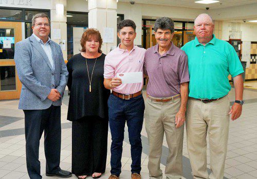 PIONEER baseball captain Nick Aslanian was the 2017 recipient of the $1,000 scholarship awarded annually to a senior on the baseball team from the Wakefield Co-operative Bank. From left: Michael Wolnik, president and CEO of Wakefield Co-operative Bank; Julia Aslanian, Nick Aslanian, Ray Aslanian and LHS baseball coach John O’Brien. (Courtesy Photo)