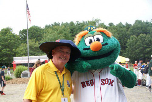 North Reading Little League President Eddie Madden with Red Sox mascot Wally the Green Monster at last weekend's state Little League Finals at Benevento Field.