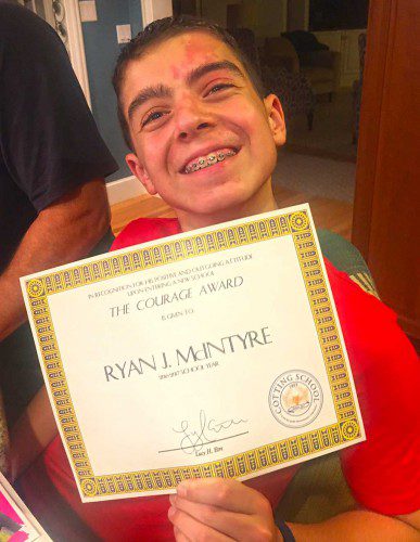 RYAN McINTYRE, 12, proudly displays the Courage Award he was presented by the Cotting School for “his positive and outgoing attitude upon entering a new school.” (Courtesy Photo)
