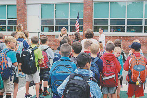 The students at the Walton School started their day off as they always do, saying the Pledge of Allegiance, led by Mrs. Kristin Liberti and Principal Elaina Byrne. 